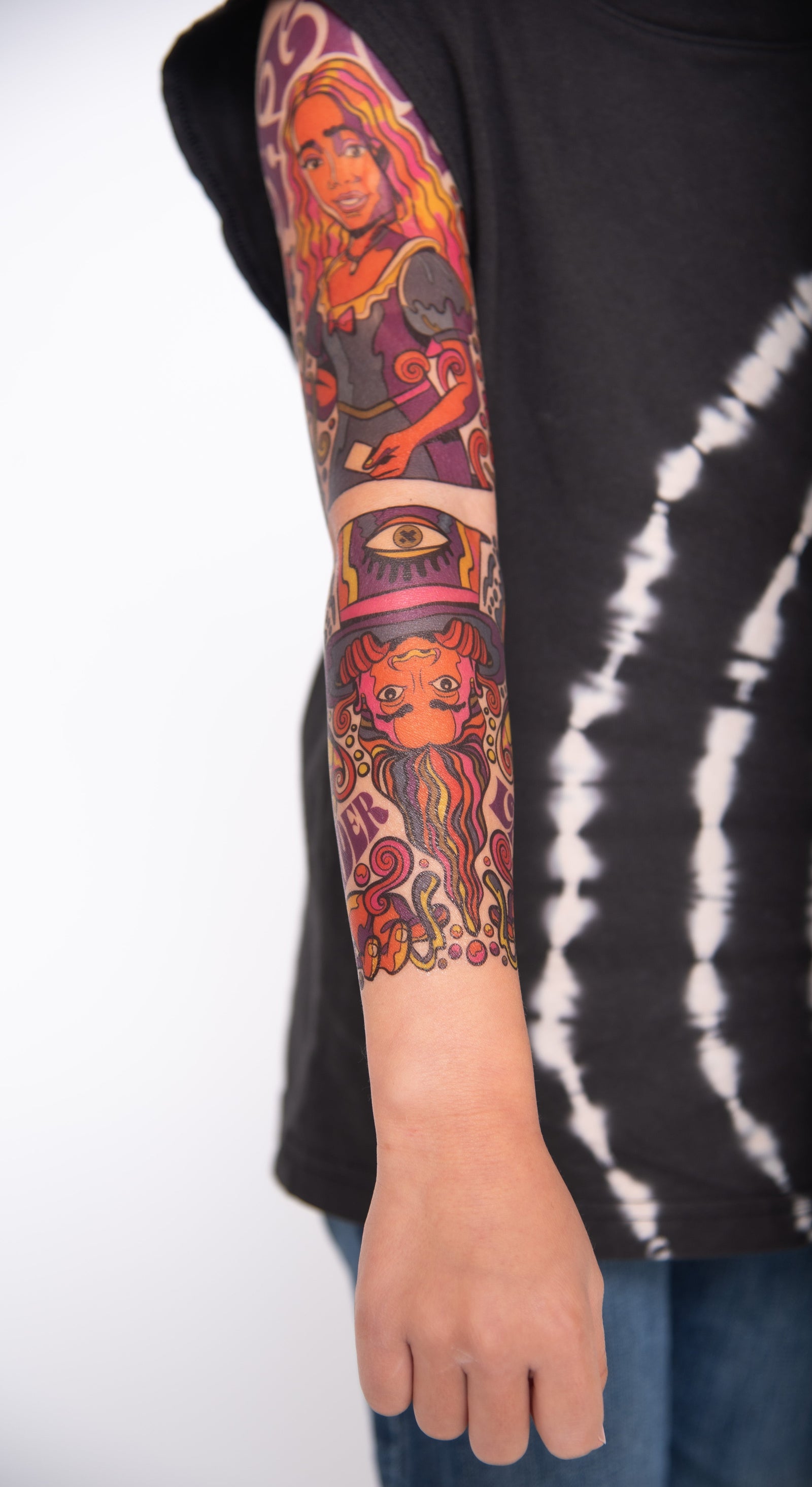 temporary tattoo sleeve for kids with colorful illustrated characters covering the full arm in a realistic kids tattoo sleeve design