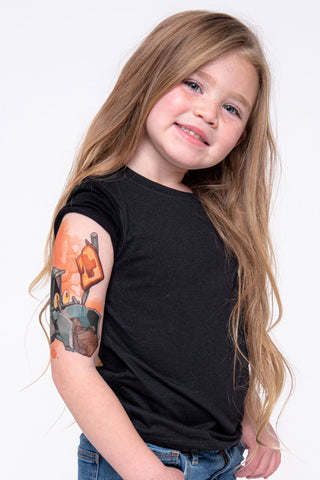 Young girl shows her upper construction temporary tattoo sleeve from Tony Ray Tattoos.