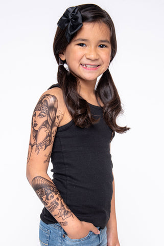 Girl showing full chicano temporary tattoo sleeve