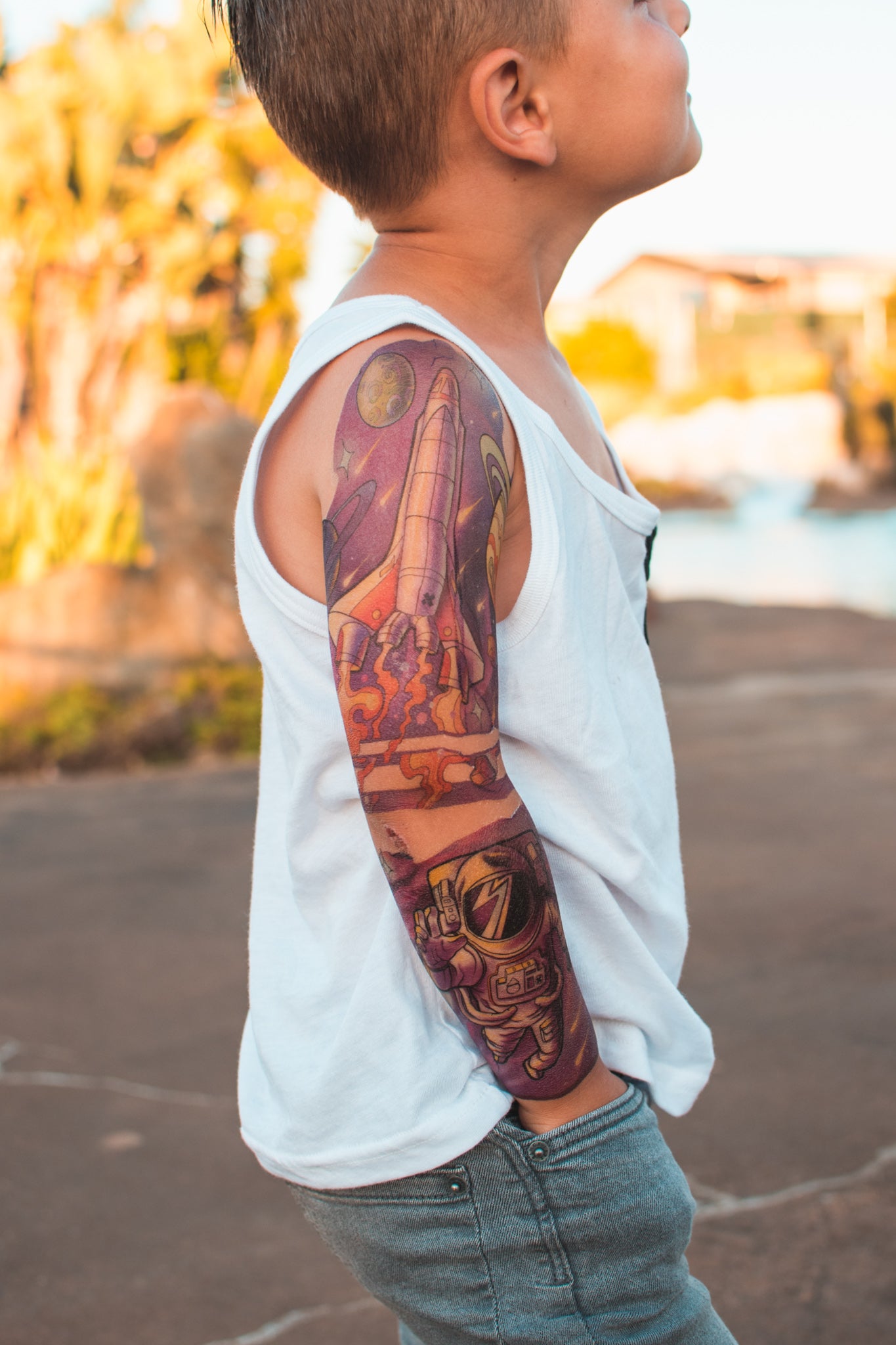 Cosmic Cruiser Full Sleeve Tattoo - alien astronaut boy explore flying saucer full sleeve Kate Shevtsova neo-traditional Rocket space spaceship full sleeve temporary tattoo for kids